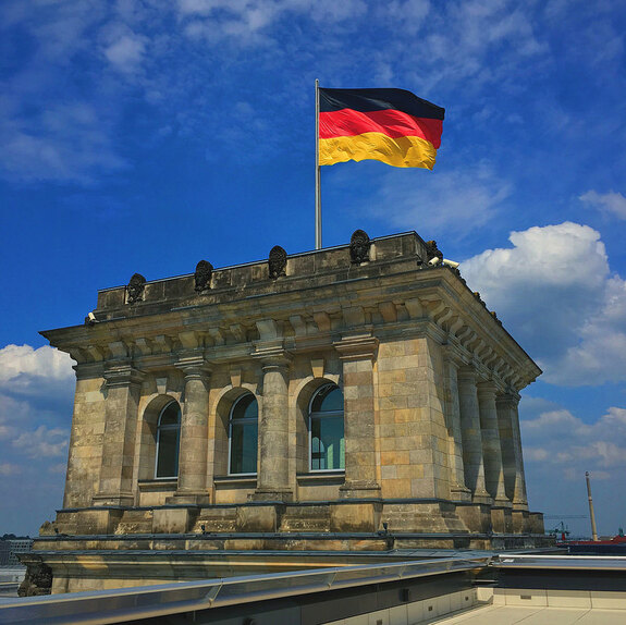 A picture of a building with Germany's flag.
